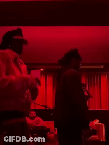 Man In Dark Room With Red Light GIF