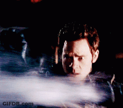 Man In Dark Room With Smoke Eyes GIF