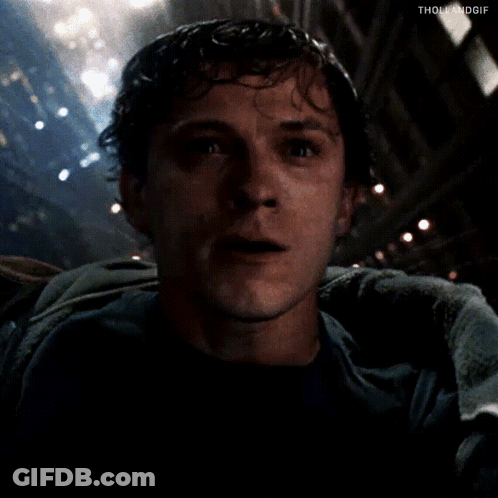 Man In Dark Room With Towel Around Shoulders GIF