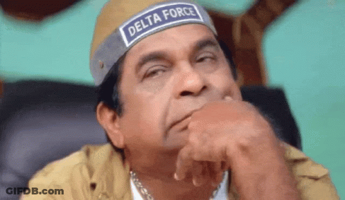Man In Delta Force Headband Sitting With Hand On Chin GIF