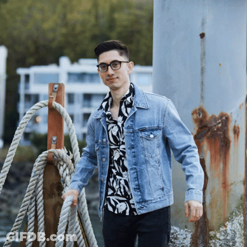 Man In Denim Jacket And Floral Shirt GIF