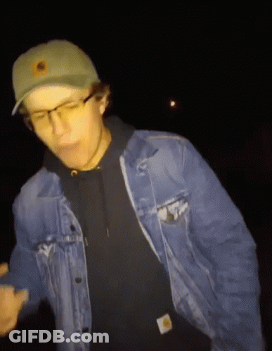 Man In Denim Jacket And Green Hat With Sun GIF