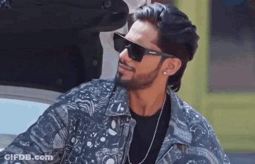 Man In Denim Jacket And Sunglasses Next To Car GIF