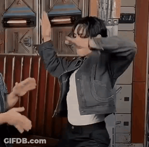 Man In Denim Jacket Dancing With Group GIF