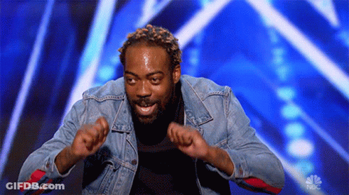 Man In Denim Jacket Dancing With Hands Up GIF