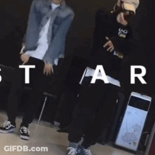 Man In Denim Jacket Dancing With Man In Baseball Cap GIF