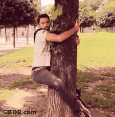 Man In Denim Jacket Eating Food With Chinese Writing GIF