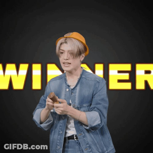 Man In Denim Jacket Holding Wood At Winner Sign GIF