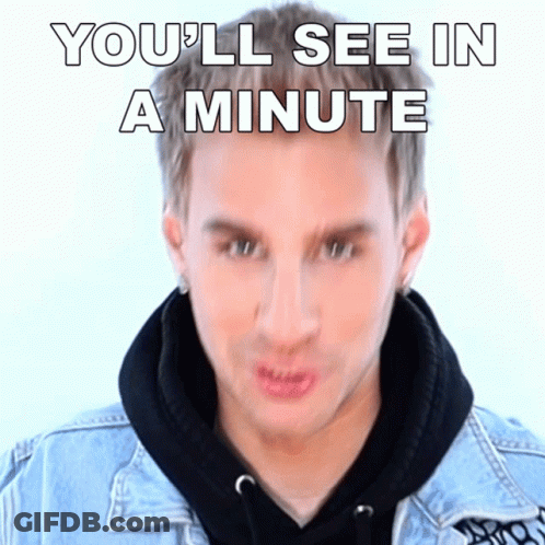 Man In Denim Jacket Making Funny Face Saying You'll See In A Minute GIF