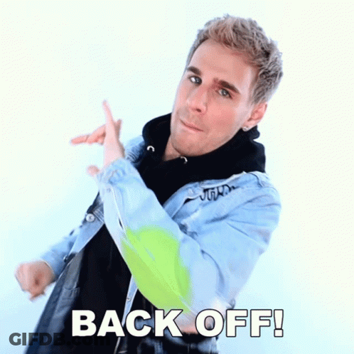 Man In Denim Jacket Pointing Back Off GIF