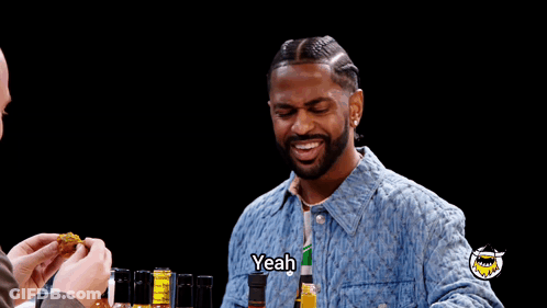 Man In Denim Jacket Saying Yeah Near Bottles GIF
