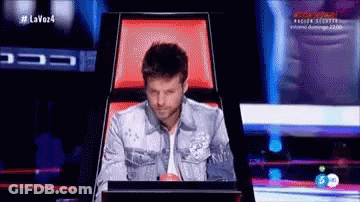 Man In Denim Jacket Sitting At Computer GIF