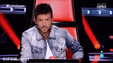Man In Denim Jacket Sitting At Computer GIF