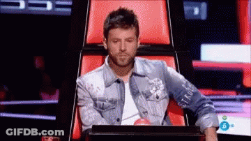 Man In Denim Jacket Sitting With Laptop GIF