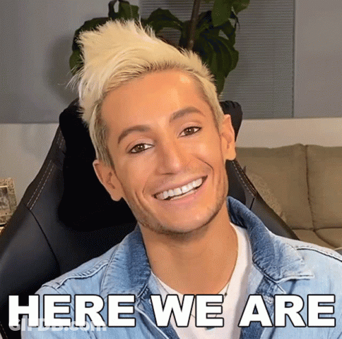 Man In Denim Jacket Smiling Here We Are GIF