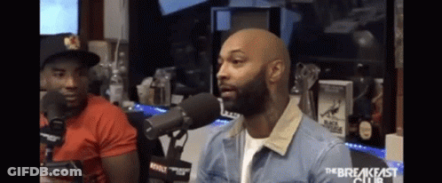 Man In Denim Jacket Talking Into Microphone GIF