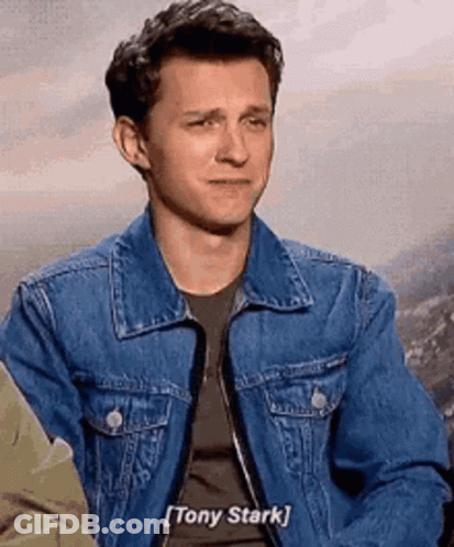 Man In Denim Jacket Talking To Tony Stark GIF