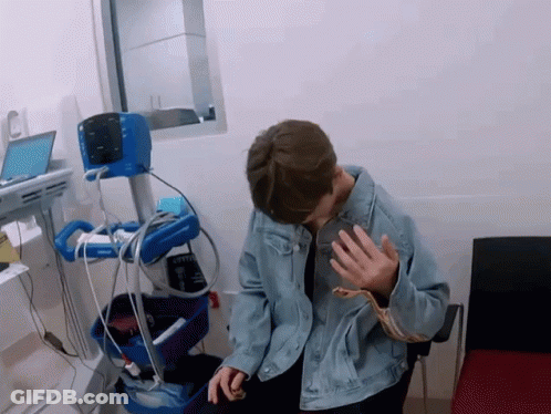 Man In Denim Jacket With Philips Medical Device GIF