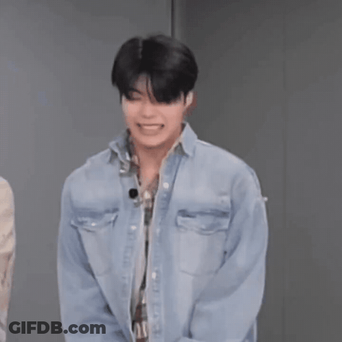 Man In Denim Shirt Laughing Hands Behind Back GIF
