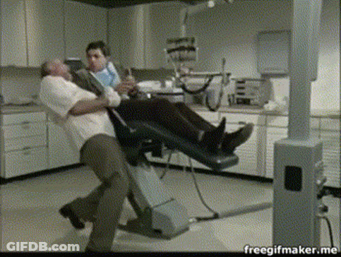 Man In Dental Chair Held By Another Man Freegifmaker.me GIF