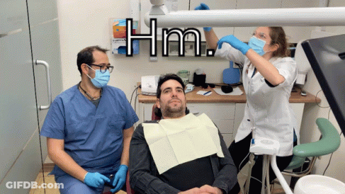 Man In Dental Chair With Two Dentists Hm GIF