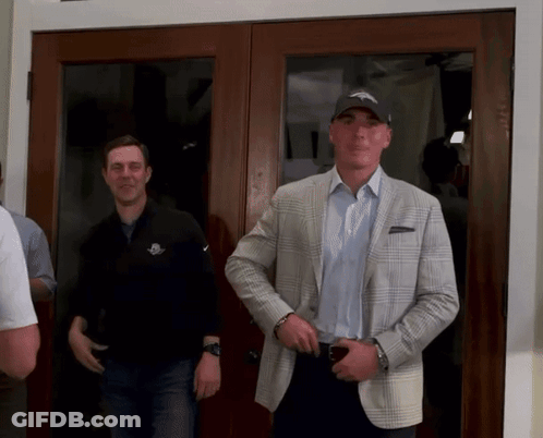 Man In Denver Broncos Hat In Front Of Glass Door GIF