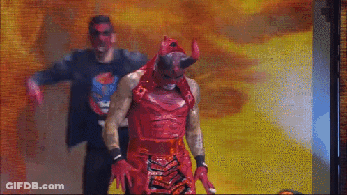 Man In Devil Costume Next To Man In Black Shirt GIF