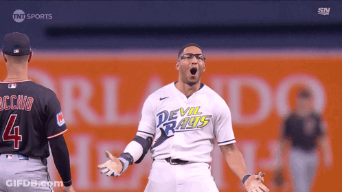 Man In Devil Rays Jersey Stands On Field GIF