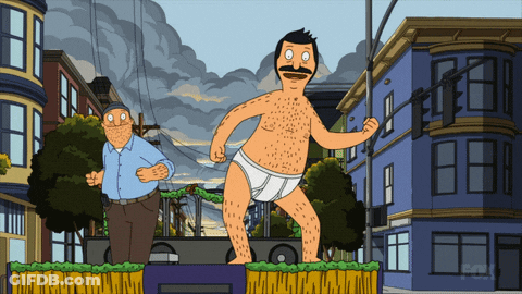 Man In Diaper Standing Before Buildings GIF