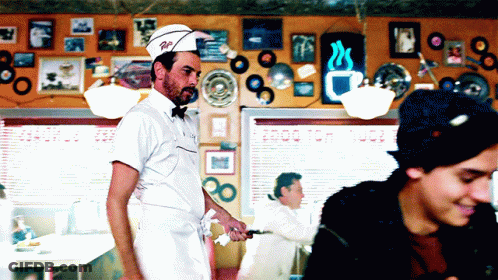 Man In Diner Wearing Hat Saying R.I GIF