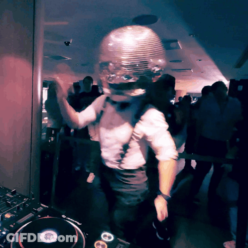 Man In Disco Ball Helmet Dancing In Front Of Pioneer Mixer GIF