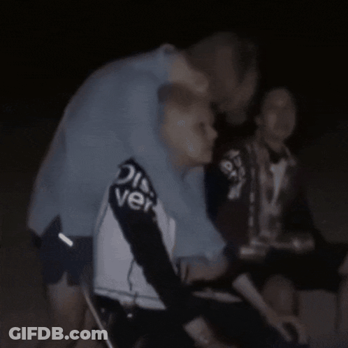 Man In Discover Shirt Hugging Another Man GIF