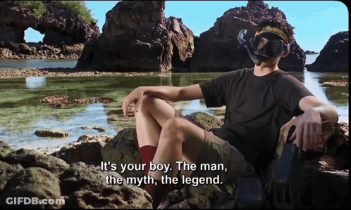 Man In Diving Mask On Rock By Water GIF