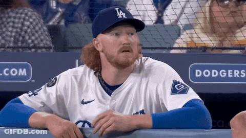 Man In Dodgers Hat Looking At Something GIF