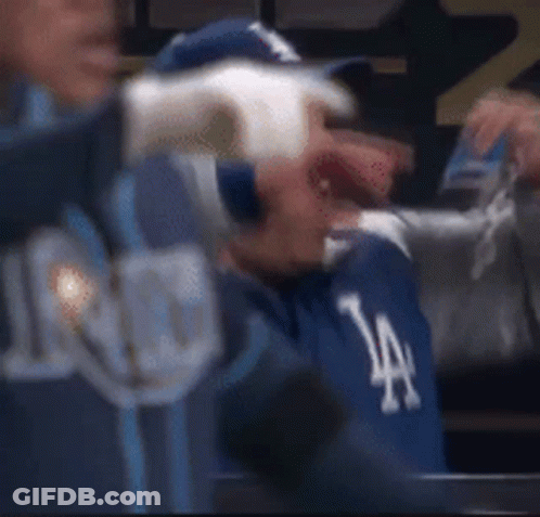 Man In Dodgers Hat Sitting In Dugout GIF