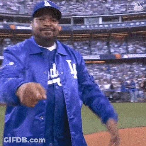 Man In Dodgers Jacket And Hat Pointing GIF
