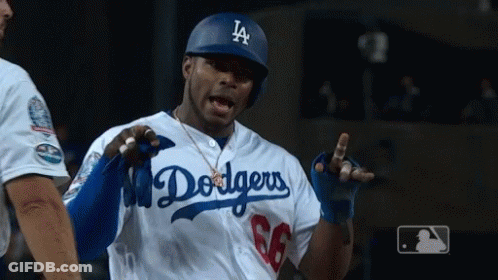 Man In Dodgers Jersey And Helmet Talking To Another Man GIF