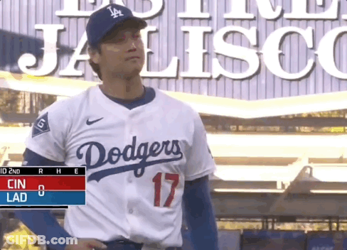 Man In Dodgers Jersey In Front Of Jalisco Sign GIF
