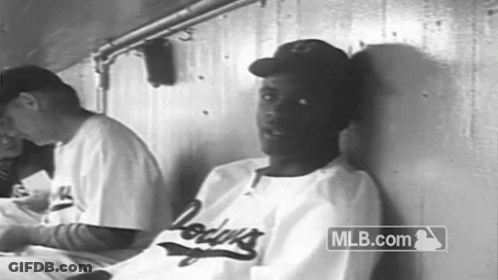 Man In Dodgers Jersey Leaning In Black And White GIF