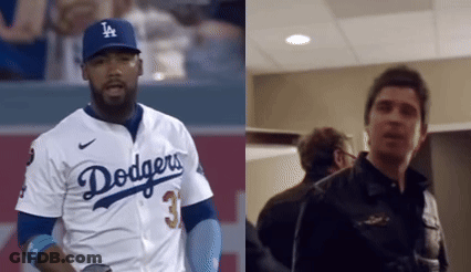 Man In Dodgers Jersey Next To Man In Black Jacket GIF