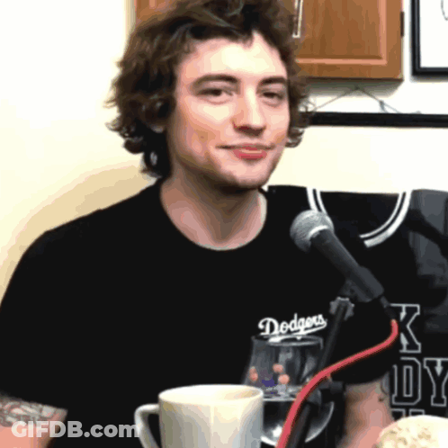 Man In Dodgers T-Shirt At Microphone GIF