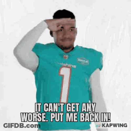 Man In Dolphins Jersey Holding Hand To Forehead Making Funny Face GIF