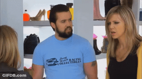Man In Dong Welch Racing T-Shirt Talking To Two Women GIF