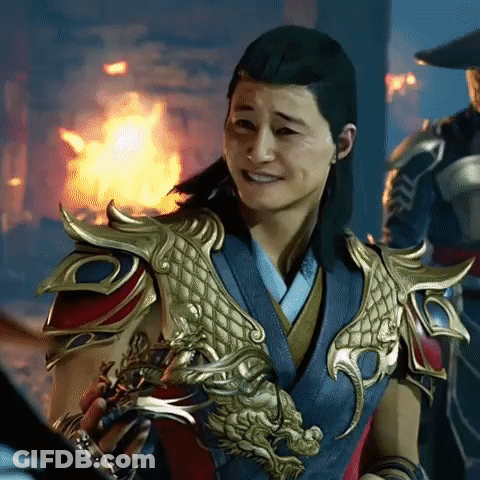 Man In Dragon Armor Smiling By Fire GIF