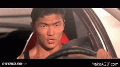 Man In Driver's Seat Looking Out Window GIF