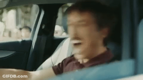 Man In Driver's Seat Making Funny Face GIF