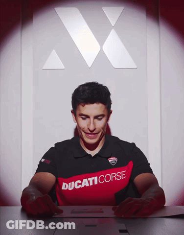 Man In Ducati Corse Shirt Looking Down GIF