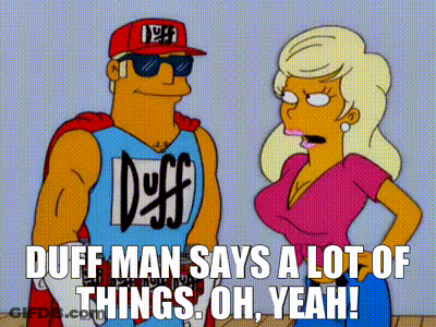 Man In Duff Shirt Standing Next To Woman GIF