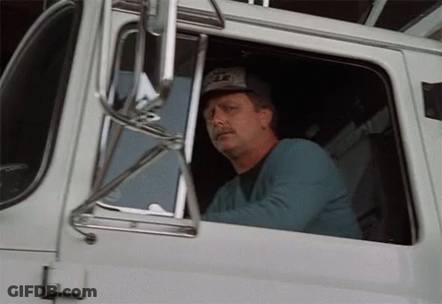 Man In Eagle Hat Driving Truck GIF