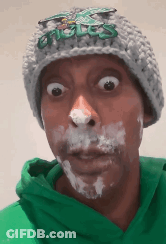 Man In Eagles Hat Green Hoodie Whipped Cream GIF